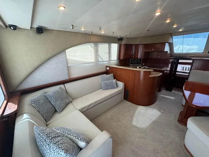  Yacht Photos Pics Luxurious interior of 2009 Silverton 45 Convertible yacht with elegant seating and modern kitchen.