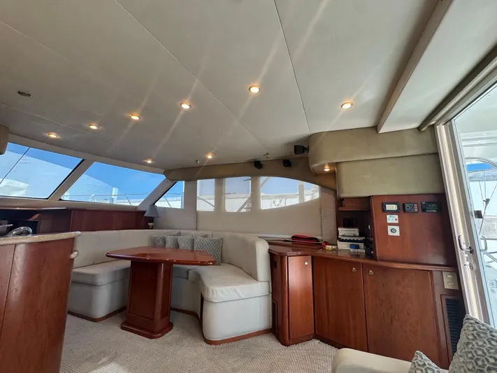  Yacht Photos Pics Luxurious interior of 2009 Silverton 45 Convertible yacht with elegant seating and wood finishes.