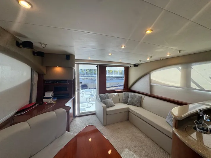  Yacht Photos Pics Luxurious interior of a 2009 Silverton 45 Convertible yacht with plush seating and elegant design.