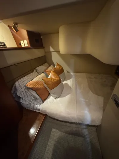  Yacht Photos Pics Luxurious cabin interior of 2009 Silverton 45 Convertible yacht with cozy bedding.