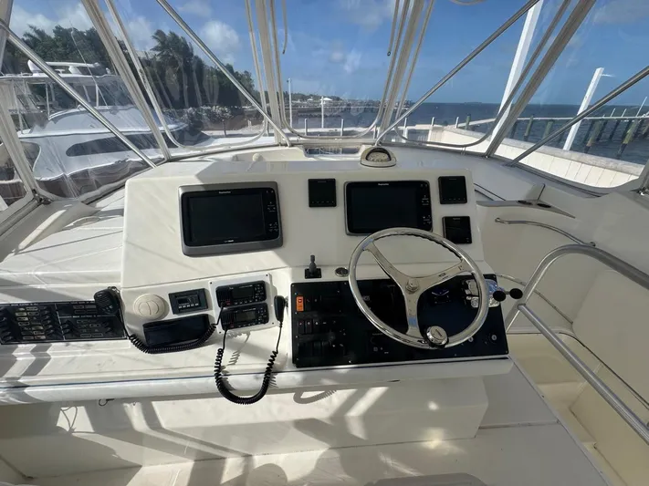  Yacht Photos Pics 2009 Silverton 45 Convertible yacht helm with steering wheel and navigation equipment.