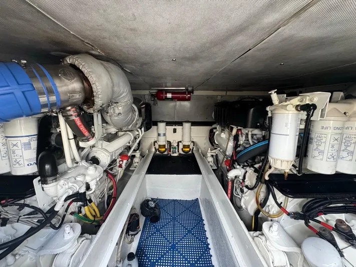  Yacht Photos Pics Engine room of 2009 Silverton 45 Convertible yacht, showcasing mechanical components and systems.