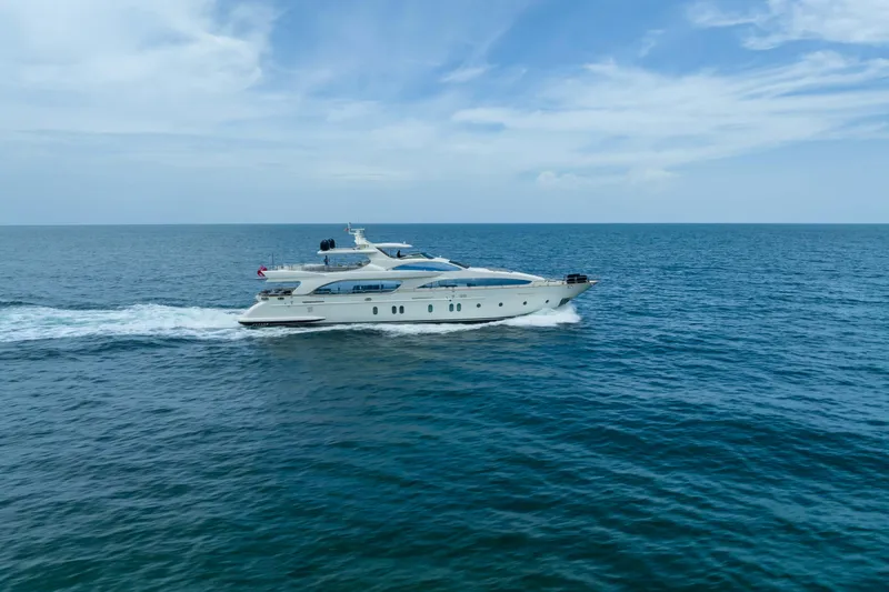  Yacht Photos Pics Luxurious 2012 Azimut yacht cruising on open sea under clear blue sky.