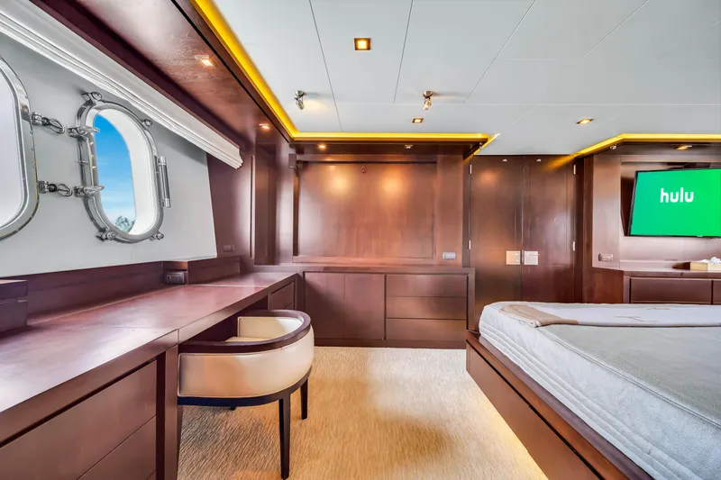  Yacht Photos Pics Luxurious Azimut yacht interior, 2012 model, featuring elegant wood paneling and a porthole view.