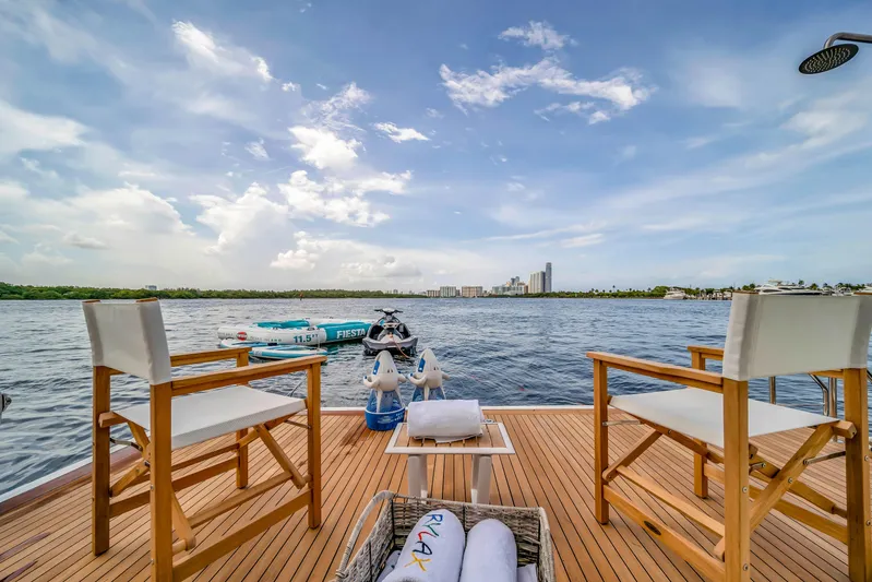  Yacht Photos Pics Luxury yacht deck with chairs, overlooking serene water and city skyline, Azimut 2012.