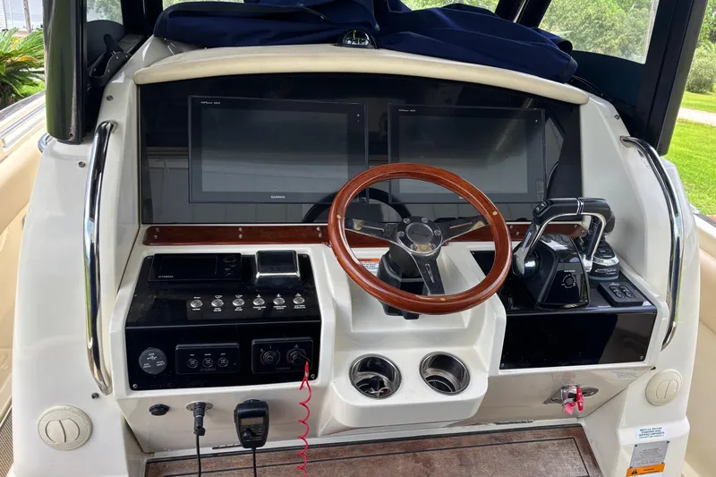  Yacht Photos Pics 2018 Chris-Craft 350 Catalina helm with wooden steering wheel and modern controls.