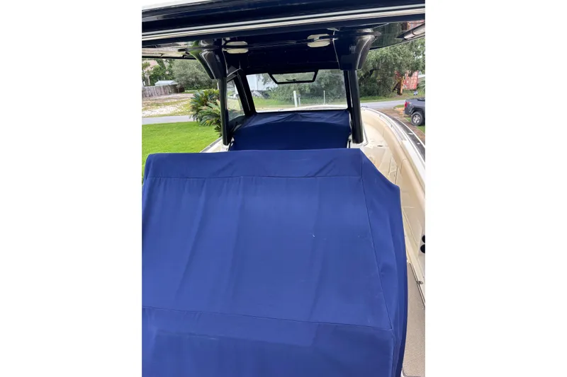  Yacht Photos Pics 2018 Chris-Craft 350 Catalina boat with blue covers, docked outdoors.