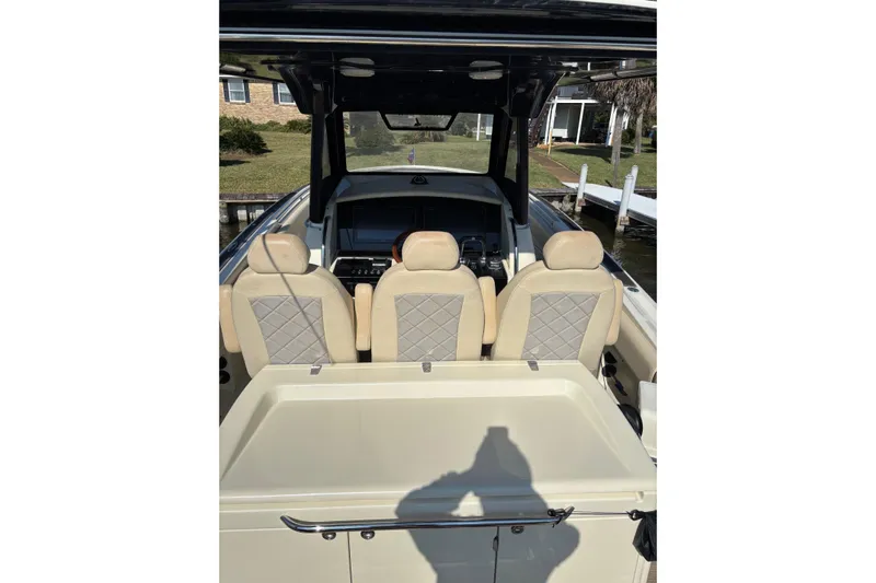 Yacht Photos Pics 2018 Chris-Craft 350 Catalina boat interior with beige seats and control panel.