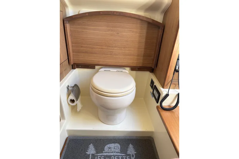  Yacht Photos Pics 2018 Chris-Craft 350 Catalina bathroom with wooden accents and modern fixtures.