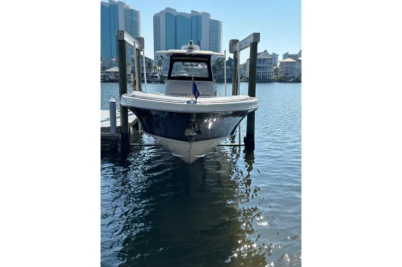  Yacht Photos Pics 2018 Chris-Craft 350 Catalina docked in a marina with cityscape background.