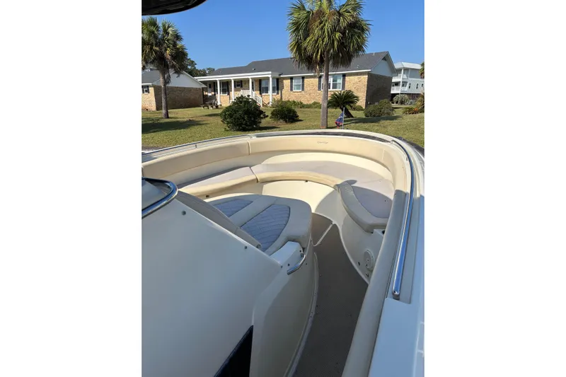  Yacht Photos Pics 2018 Chris-Craft 350 Catalina boat with spacious seating, docked near a house and palm trees.