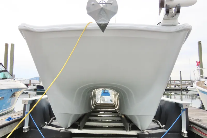  Yacht Photos Pics 2024 Freeman 38 boat hull on trailer at marina, viewed from front.