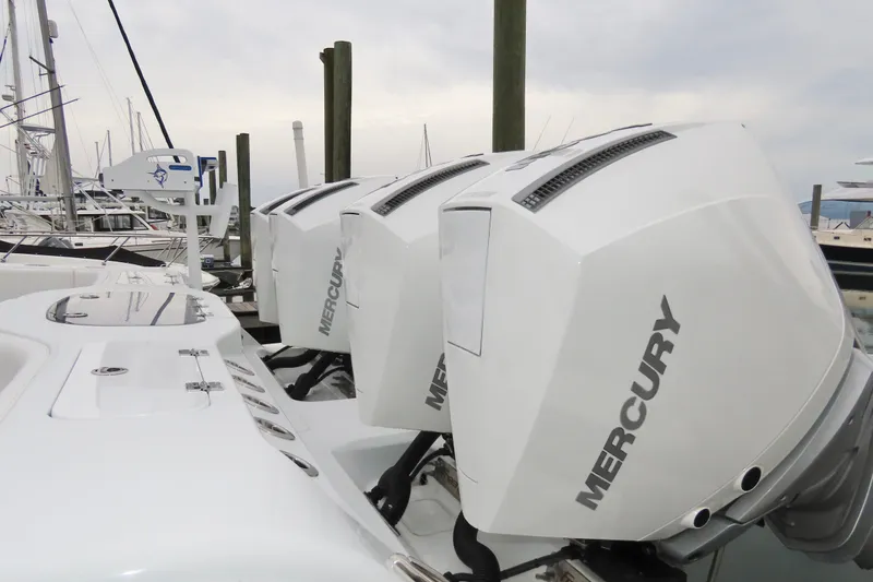  Yacht Photos Pics Triple Mercury outboard engines on a 2024 Freeman 38 boat at a marina.