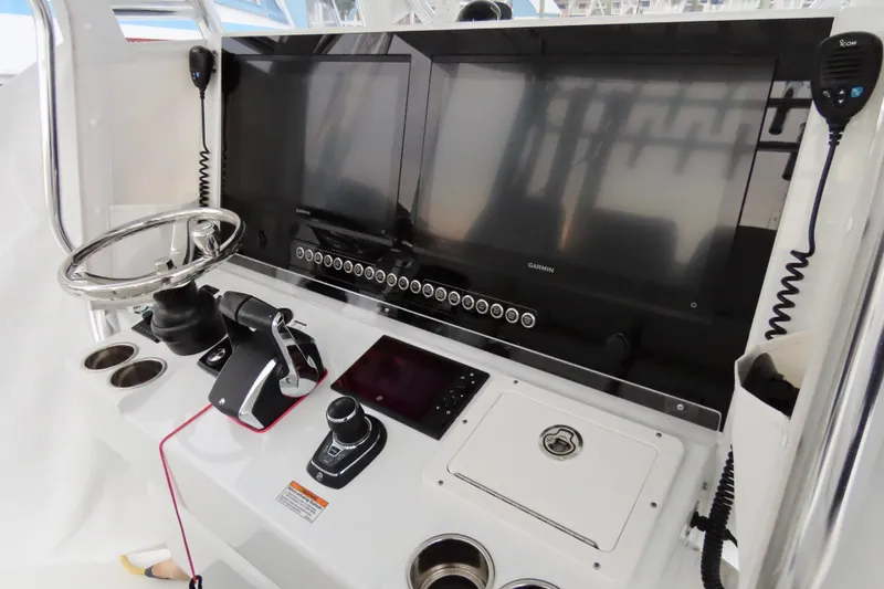  Yacht Photos Pics 2024 Freeman 38 boat dashboard with dual Garmin screens and modern controls.