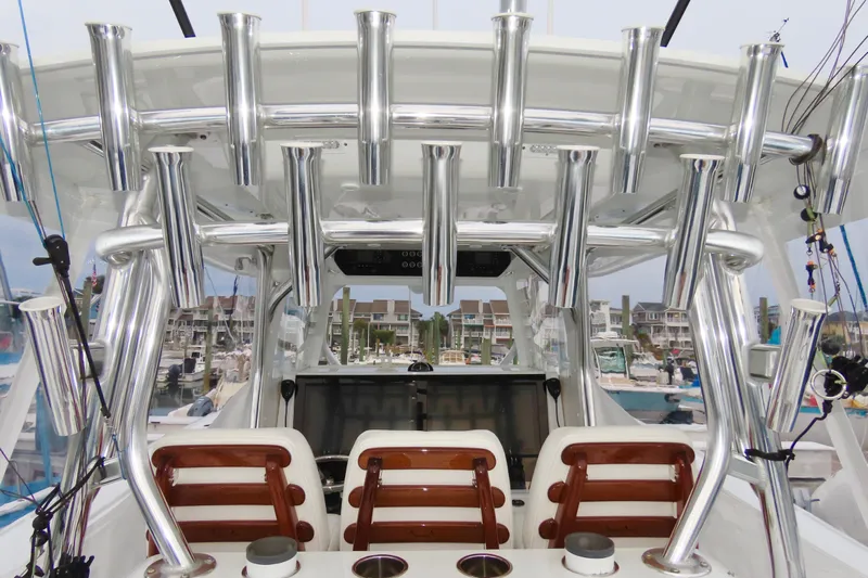  Yacht Photos Pics 2024 Freeman 38 boat interior with rod holders and seating at marina.