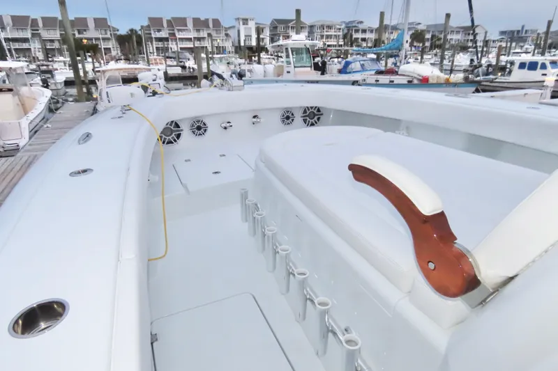  Yacht Photos Pics 2024 Freeman 38 boat interior at marina, featuring seating and rod holders.