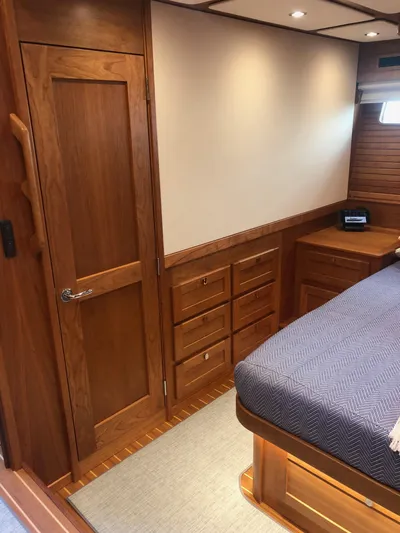 Apricity Yacht Photos Pics 2021 Sabre 58 Salon Express cabin with wooden interior and cozy bed.