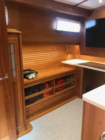 Apricity Yacht Photos Pics Interior of 2021 Sabre 58 Salon Express yacht with wooden cabinetry and modern design.