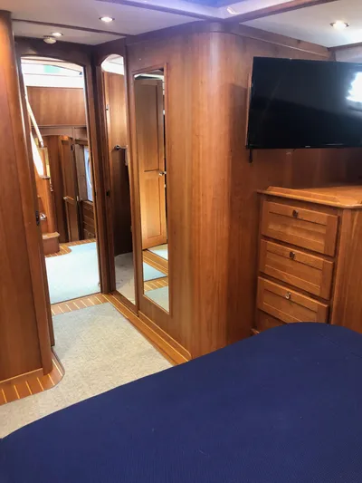 Apricity Yacht Photos Pics Luxurious 2021 Sabre 58 Salon Express cabin with wood interior and modern amenities.