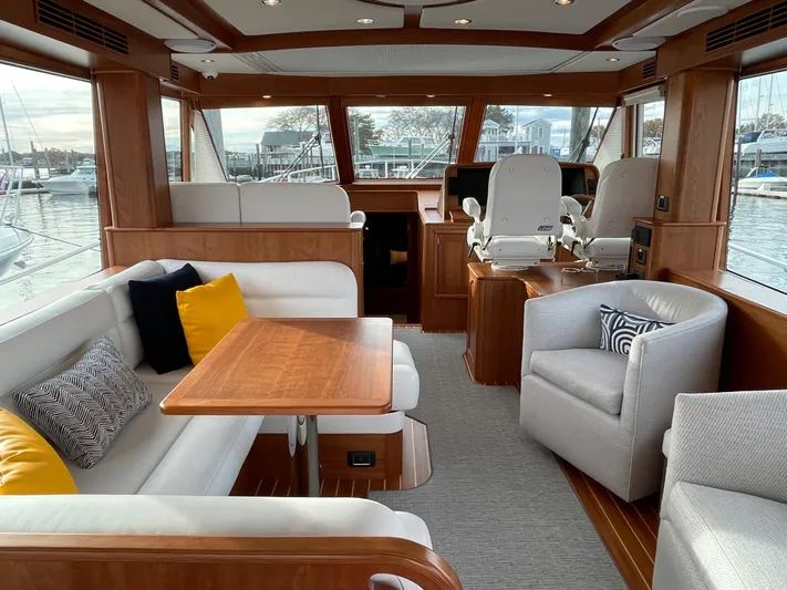 Apricity Yacht Photos Pics Luxurious 2021 Sabre 58 Salon Express interior with elegant seating and panoramic windows.