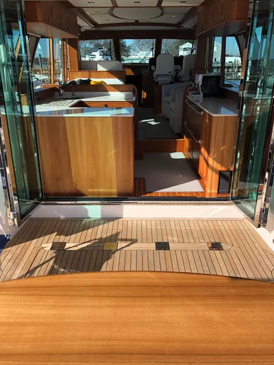 Apricity Yacht Photos Pics Interior view of 2021 Sabre 58 Salon Express yacht with wooden finishes and modern design.