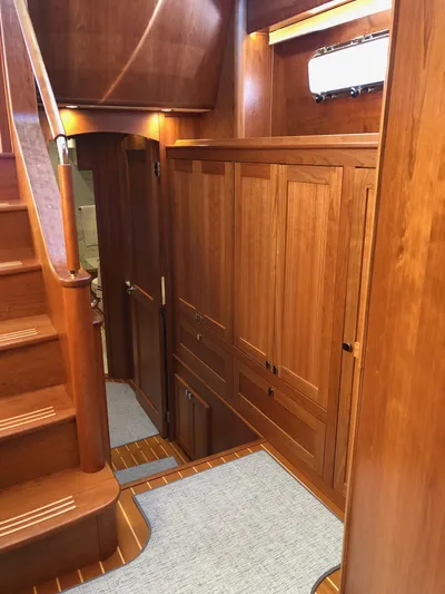 Apricity Yacht Photos Pics Interior of 2021 Sabre 58 Salon Express yacht with wooden cabinetry and staircase.