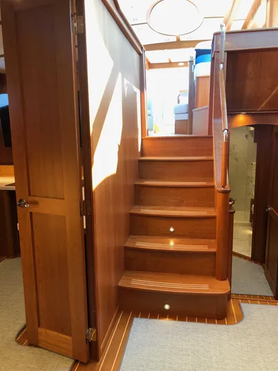 Apricity Yacht Photos Pics Interior of 2021 Sabre 58 Salon Express yacht with wooden staircase and elegant design.