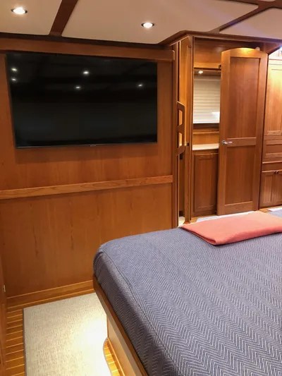 Apricity Yacht Photos Pics 2021 Sabre 58 Salon Express interior with wood paneling and large TV.