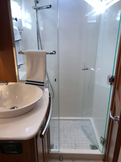 Apricity Yacht Photos Pics Modern bathroom in 2021 Sabre 58 Salon Express yacht with glass shower enclosure.