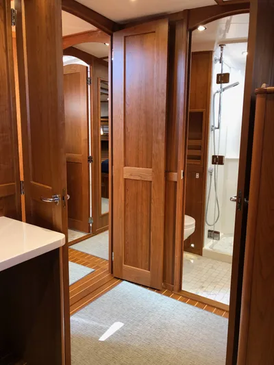 Apricity Yacht Photos Pics Luxurious interior of 2021 Sabre 58 Salon Express yacht with wooden finishes and modern bathroom.