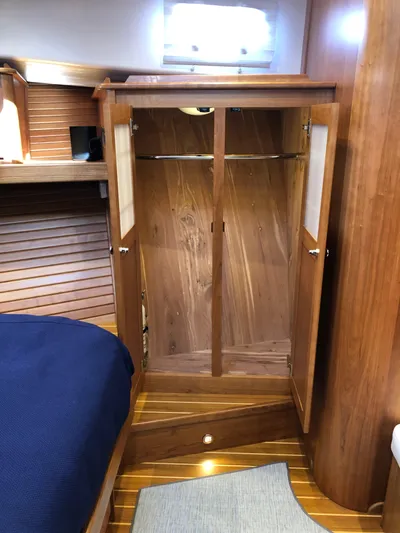 Apricity Yacht Photos Pics 2021 Sabre 58 Salon Express interior with wooden wardrobe and cozy cabin design.