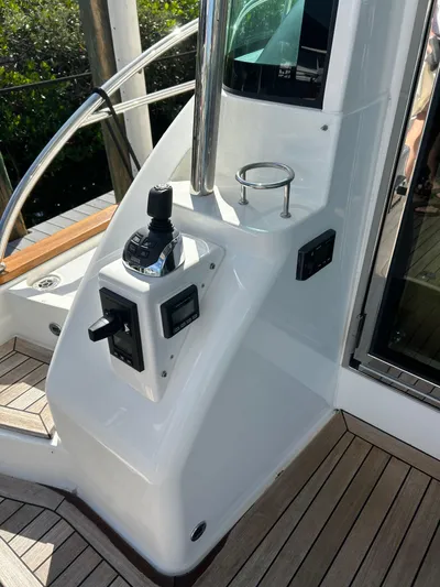 Apricity Yacht Photos Pics 2021 Sabre 58 Salon Express helm station with controls and cup holder.