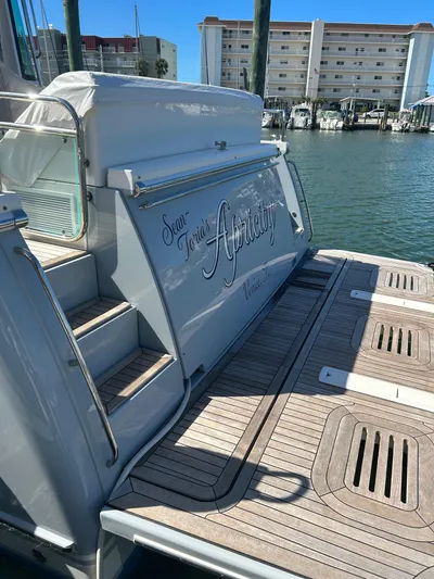 Apricity Yacht Photos Pics 2021 Sabre 58 Salon Express yacht docked at marina with wooden deck.