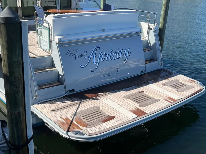 Apricity Yacht Photos Pics 2021 Sabre 58 Salon Express yacht with wooden deck, docked in Venice, FL.