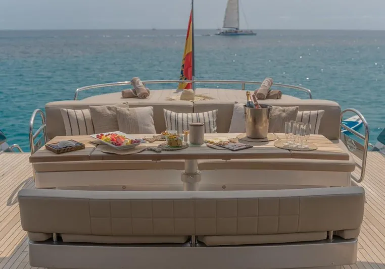 Nova Yacht Photos Pics Luxurious Sunseeker Predator 92 yacht deck with elegant seating, champagne, and ocean view.