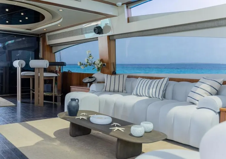 Nova Yacht Photos Pics Luxurious Sunseeker Predator 92 yacht interior with ocean view, elegant seating, and modern decor.