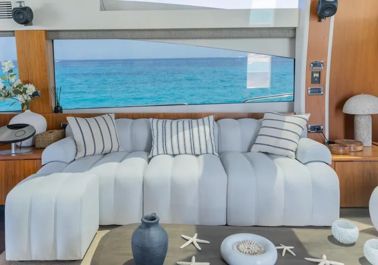 Nova Yacht Photos Pics Luxurious Sunseeker Predator 92 yacht interior with elegant white sofa and ocean view.