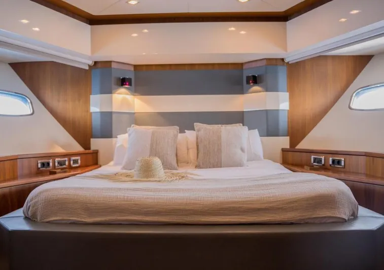Nova Yacht Photos Pics Luxurious bedroom interior of 2008 Sunseeker Predator 92 yacht with elegant wood accents.