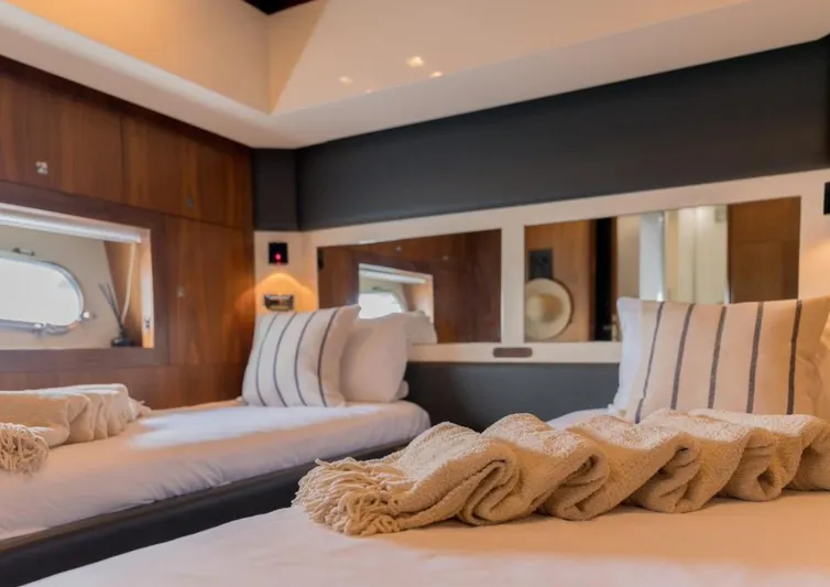 Nova Yacht Photos Pics Luxurious cabin interior of 2008 Sunseeker Predator 92 yacht with twin beds and elegant decor.