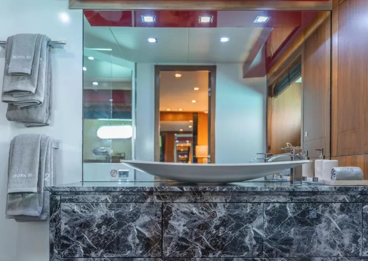 Nova Yacht Photos Pics Luxurious bathroom interior on 2008 Sunseeker Predator 92 yacht, featuring elegant marble and modern fixtures.