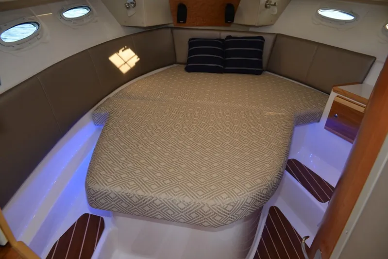 Fluidmotion Yacht Photos Pics 2020 Cutwater C-30S boat interior with cozy bed and ambient lighting.