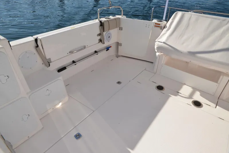 Fluidmotion Yacht Photos Pics 2020 Cutwater C-30S boat deck with seating, storage, and water view.