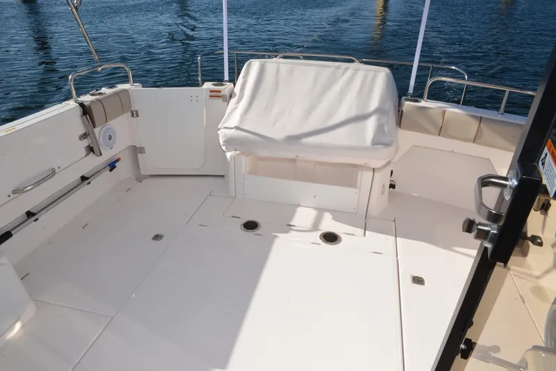 Fluidmotion Yacht Photos Pics 2020 Cutwater C-30S boat deck with seating, overlooking calm water.
