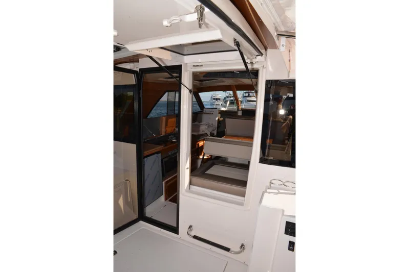 Fluidmotion Yacht Photos Pics Interior view of 2020 Cutwater C-30S boat, showcasing seating and cabin area.