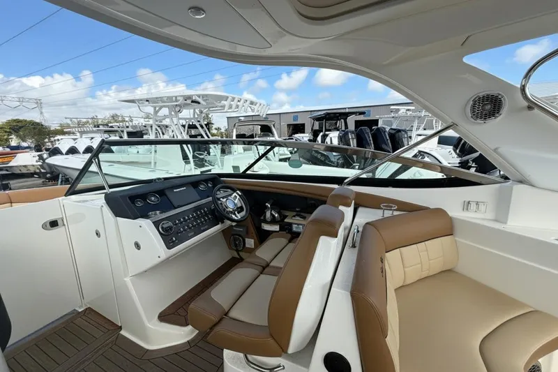  Yacht Photos Pics Interior of 2015 Sea Ray SLX 350 boat with modern dashboard and seating.