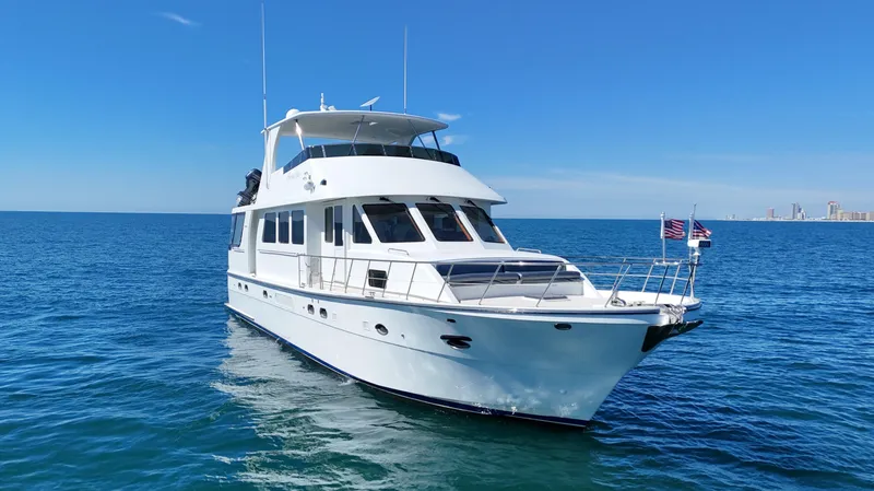  Yacht Photos Pics Luxury 2007 Jefferson Marquessa yacht on open sea under clear blue sky.