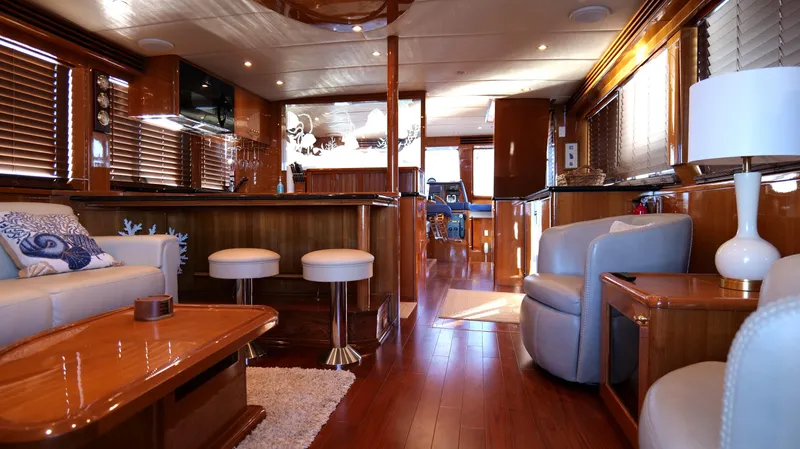  Yacht Photos Pics Luxurious interior of a 2007 Jefferson Marquessa yacht with elegant wood finishes and modern furnishings.