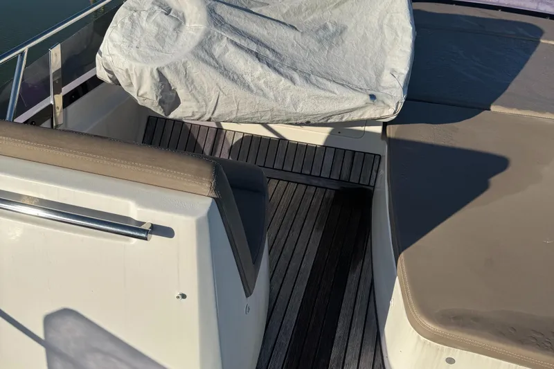  Yacht Photos Pics 2015 Prestige 450 yacht interior with covered seating and wooden flooring.