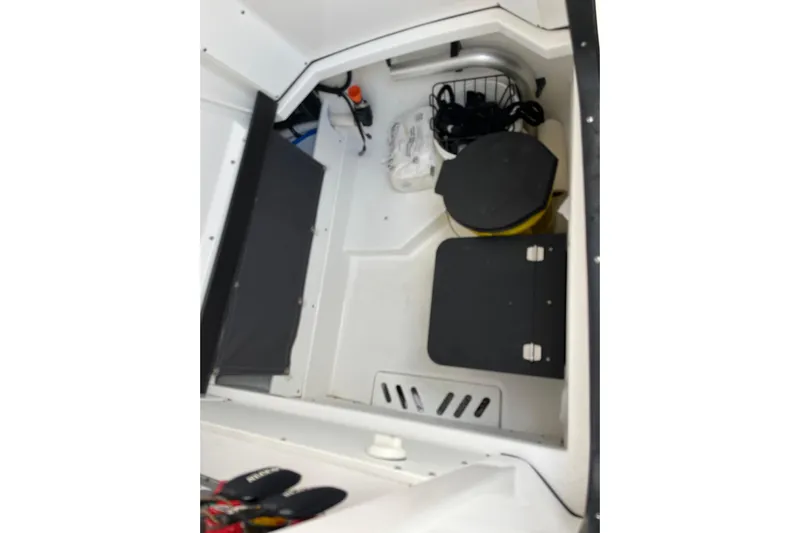  Yacht Photos Pics Interior storage compartment of 2019 Blackfin 272 CC boat with equipment and supplies.