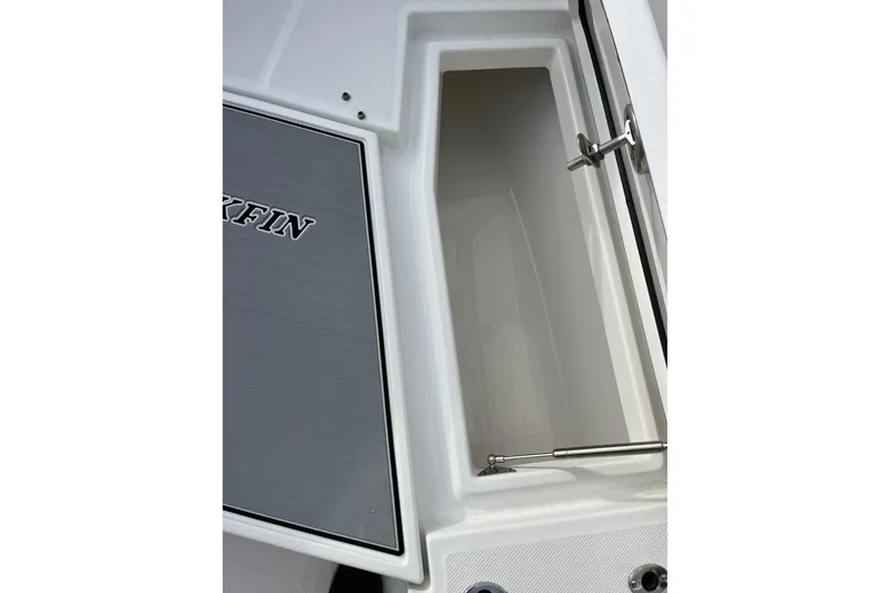  Yacht Photos Pics 2019 Blackfin 272 CC boat storage compartment with open lid and hydraulic support.